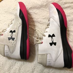 White and pink Under Armour basketball shoes
